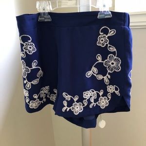 Blue shorts. Floral sides